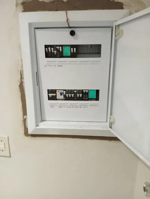 Installed distribution board with cover open, showing organised circuit breakers in a Pretoria East home
