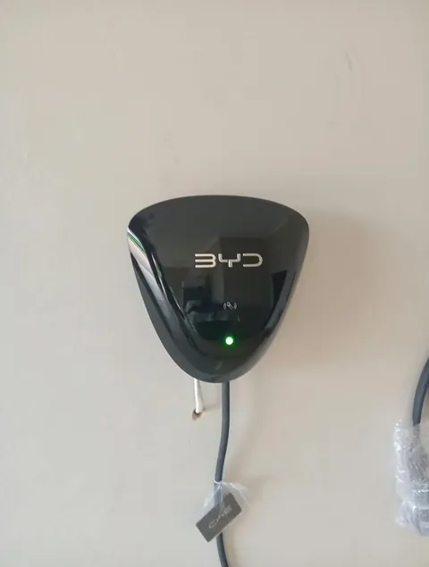 Wall-mounted BYD electric vehicle charger with green status light