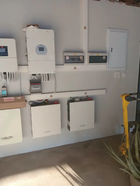 Volta and Deye battery wall with inverter and organised trunking