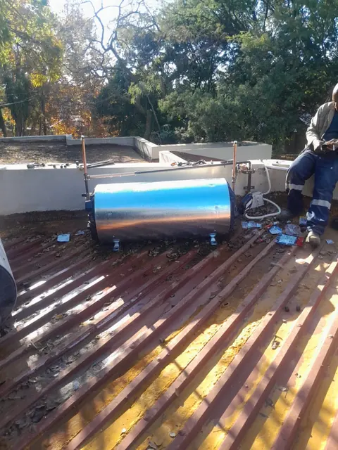 Geyser installed in a roof space with copper piping connected